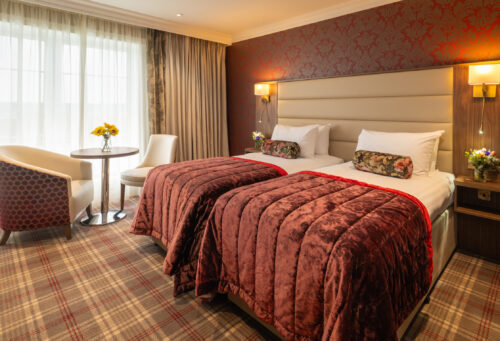 Classic Room Twin no breakfast flowers on table 1 2 - Sligo Southern Hotel